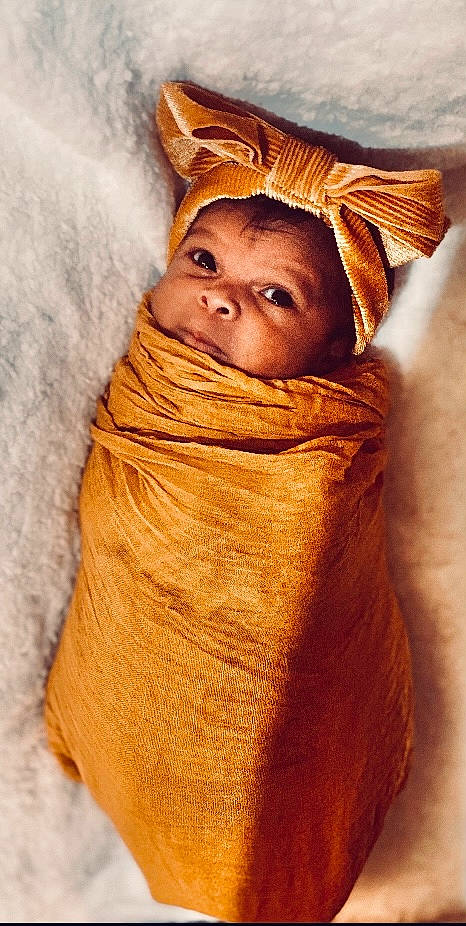 Giovanna joined the competition — help win amazing prizes! child, comfort, eye, eyebrow, face, fashion_accessory, flesh, fur, happy, head, linens, lip, nose, person, portrait_photography, shawl, textile, toddler, tradition, wood