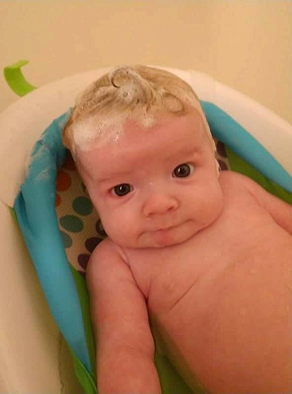 Samantha is registered to the contest to win money with this photo: baby, baby_bathing, bathing, bathtub, child, eye, face, head, mouth, person, skin, toddler