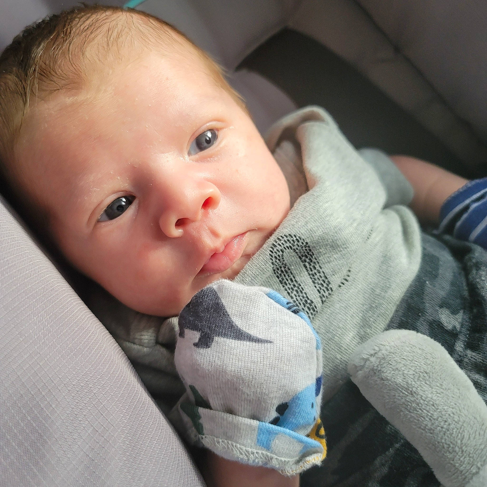 Hunter is registered to the contest to win money with this photo: baby, baby_toddler_clothing, cheek, child, chin, comfort, eye, eyebrow, eyelash, finger, gesture, head, iris, lip, mouth, nail, nose, person, skin, thumb