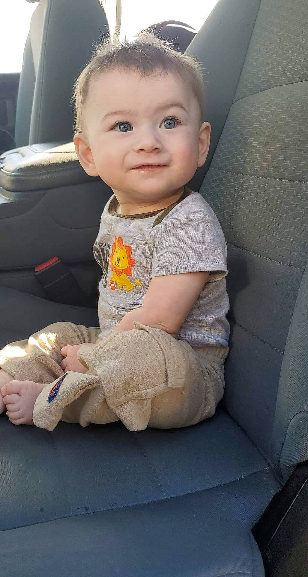 Jorden is registered to the contest to win money with this photo: auto_part, baby, baby_in_car_seat, car, car_seat, cheek, child, face, head, joy, person, seat_belt, sitting, skin, smile, toddler, vehicle