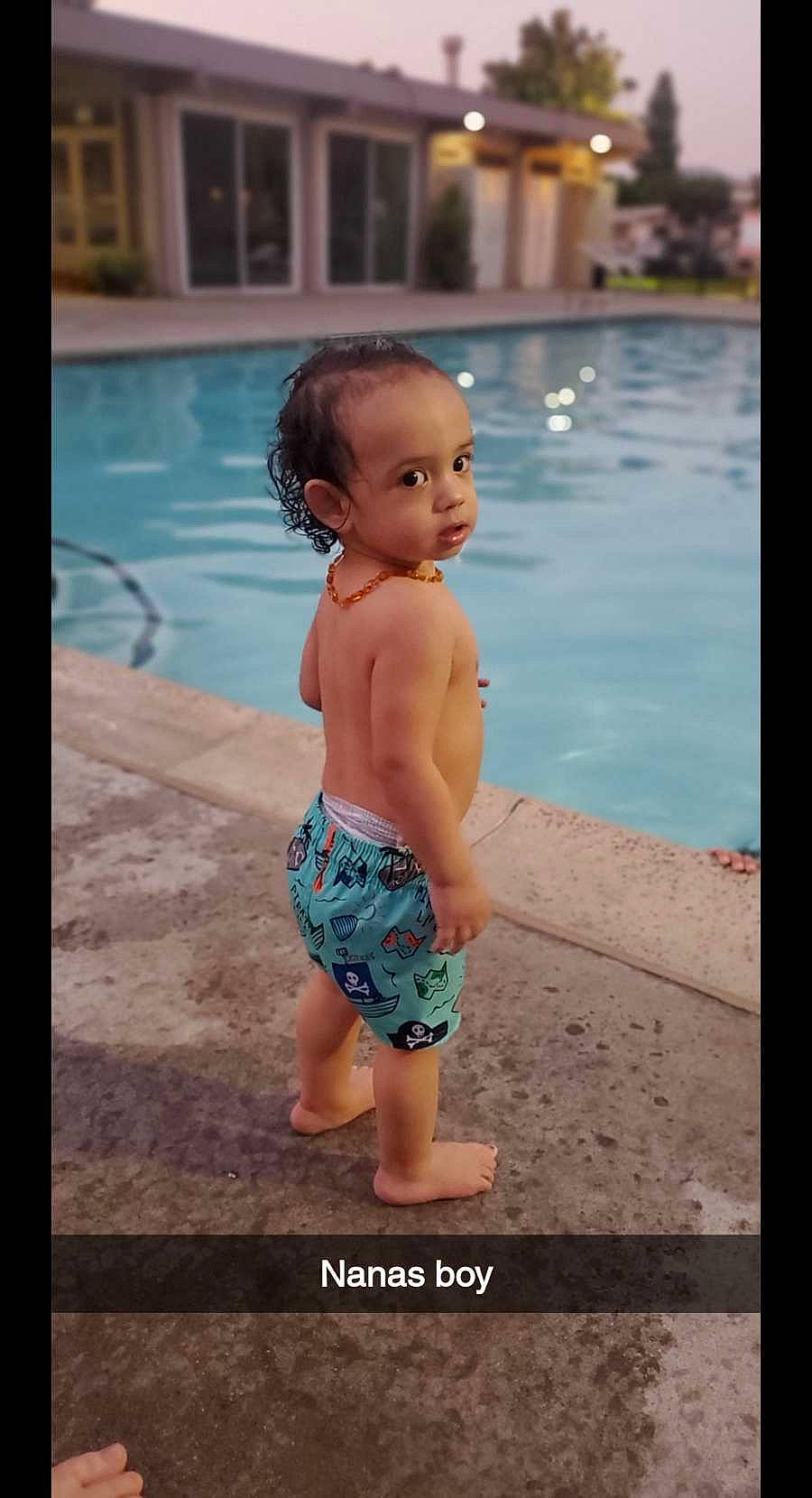 Chance Jr. is registered to the contest to win money with this photo: aqua, baby, baby_toddler_clothing, barechested, barefoot, bathing, calf, chest, child, fluid, foot, person, shoulder, skin, summer, swimming_pool, swimwear, toddler, toe, trunk