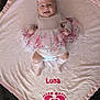 Luna joined the competition — help win amazing prizes! baby, infant, smiling, girl, tutu, headband, flower, blanket, pink, soft, footprints, name, happy, lying_down, cute, clothing, indoors, portrait, child, toddler