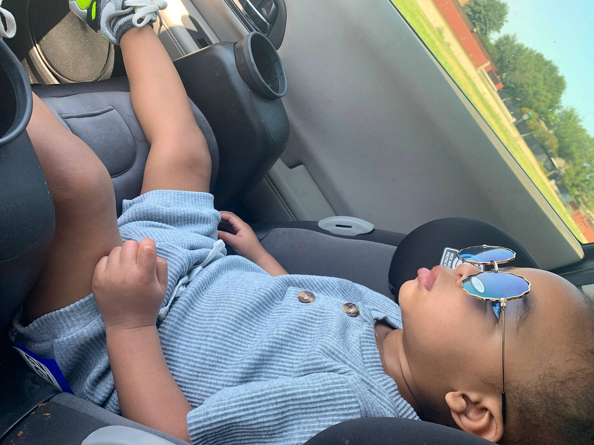 Joziah is registered to the contest to win money with this photo: arm, auto_part, automotive_design, car, car_seat_cover, comfort, finger, hat, head_restraint, joint, knee, leg, light, motor_vehicle, muscle, person, sunglasses, thigh, vehicle_door, vision_care