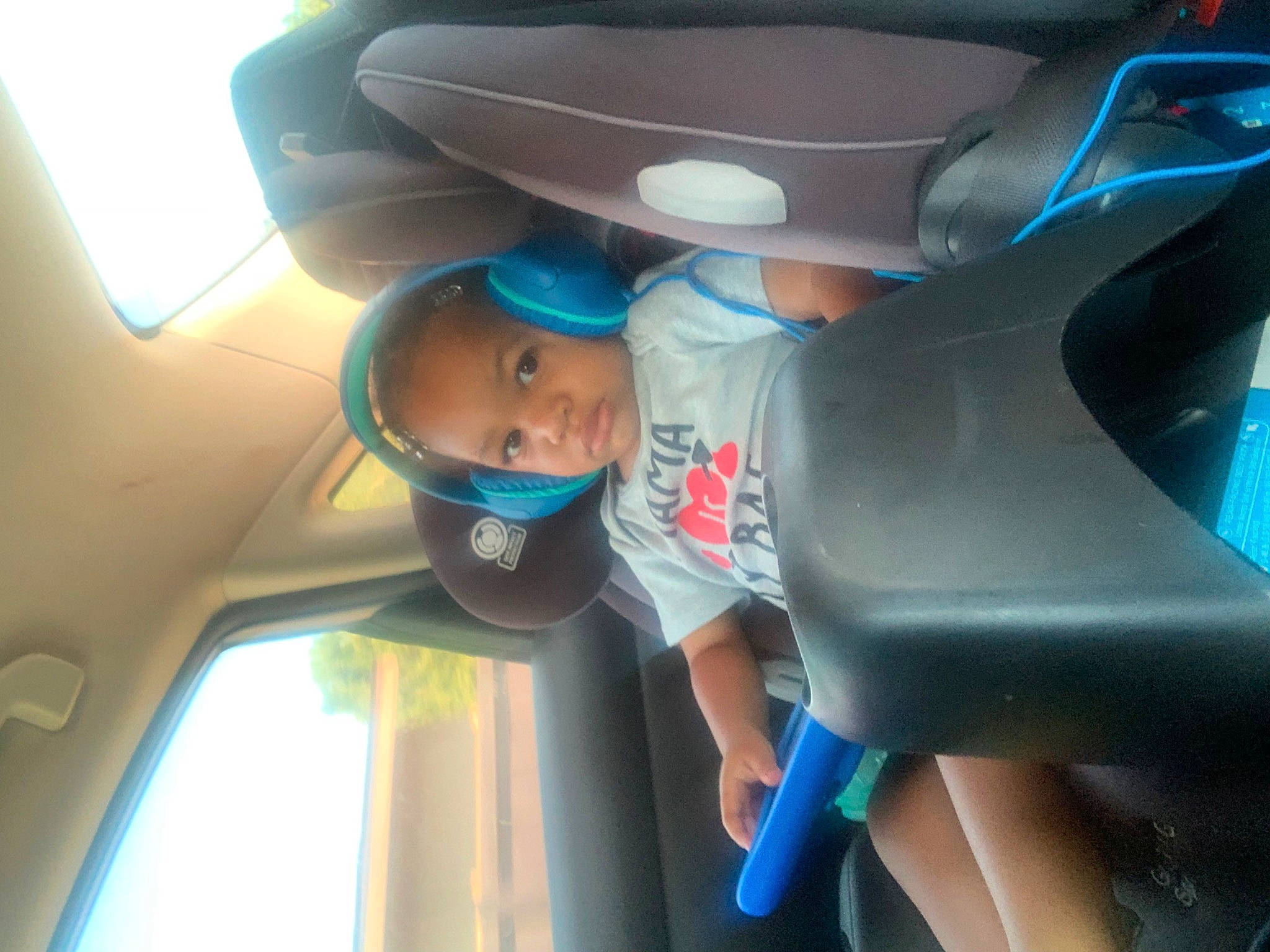 Joziah is registered to the contest to win money with this photo: auto_part, automotive_design, automotive_exterior, automotive_lighting, automotive_window_part, blue, car, car_seat, car_seat_cover, comfort, electric_blue, family_car, fun, hat, human_leg, mode_of_transport, motor_vehicle, person, personal_luxury_car, vehicle