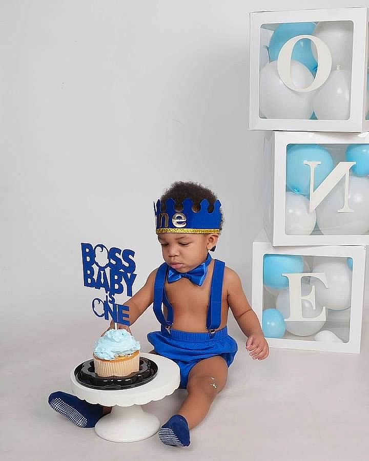 Joziah joined the competition — help win amazing prizes! action_figure, animation, audio_equipment, bathing, blue, cake_decorating, child, electric_blue, fictional_character, font, headwear, icing, output_device, person, personal_protective_equipment, plastic, product, shelving, shorts, sitting