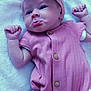 Rayne joined the competition — help win amazing prizes! baby, infant, pout, pink_bow, headband, romper, buttoned_clothing, white_blanket, raised_fists, cute_expression, lying_down, indoor, soft_texture, newborn, child, adorable, portrait, closeup, person, young_child