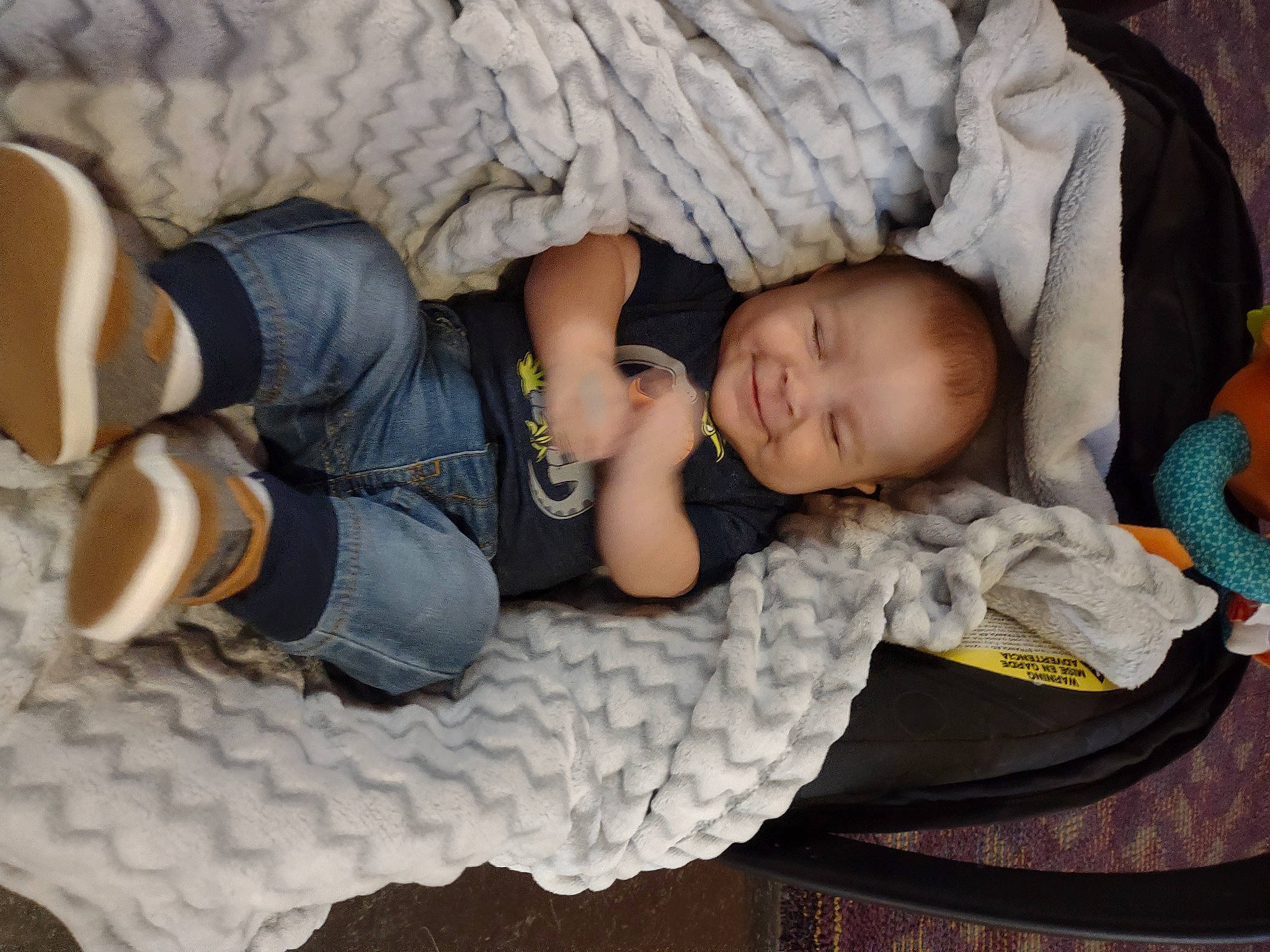 Jaxon is registered to the contest to win money with this photo: baby, baby_products, baby_sleeping, baby_toddler_clothing, bedtime, child, comfort, flooring, grass, headgear, knit_cap, knitting, linens, nap, pattern, person, sitting, thigh, toddler, wood