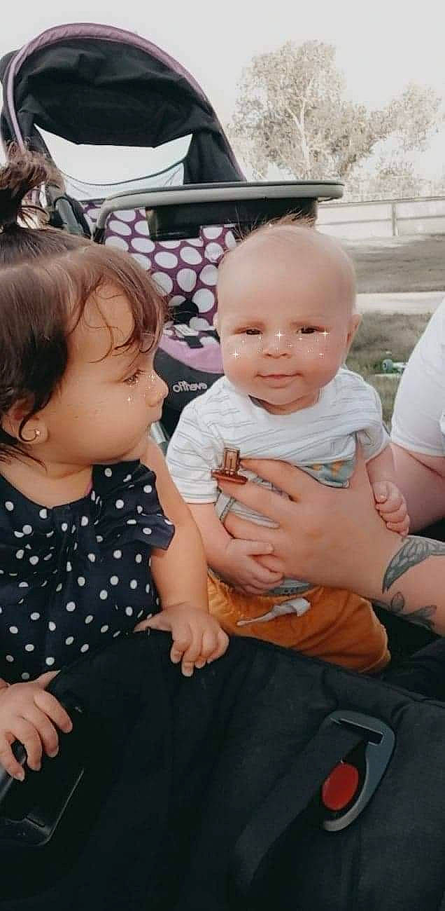 Jaxon is registered to the contest to win money with this photo: baby, cheek, child, event, facial_expression, formal_wear, fun, gesture, happy, interaction, jewellery, leisure, nail, pattern, person, shorts, sitting, skin, t_shirt, toddler