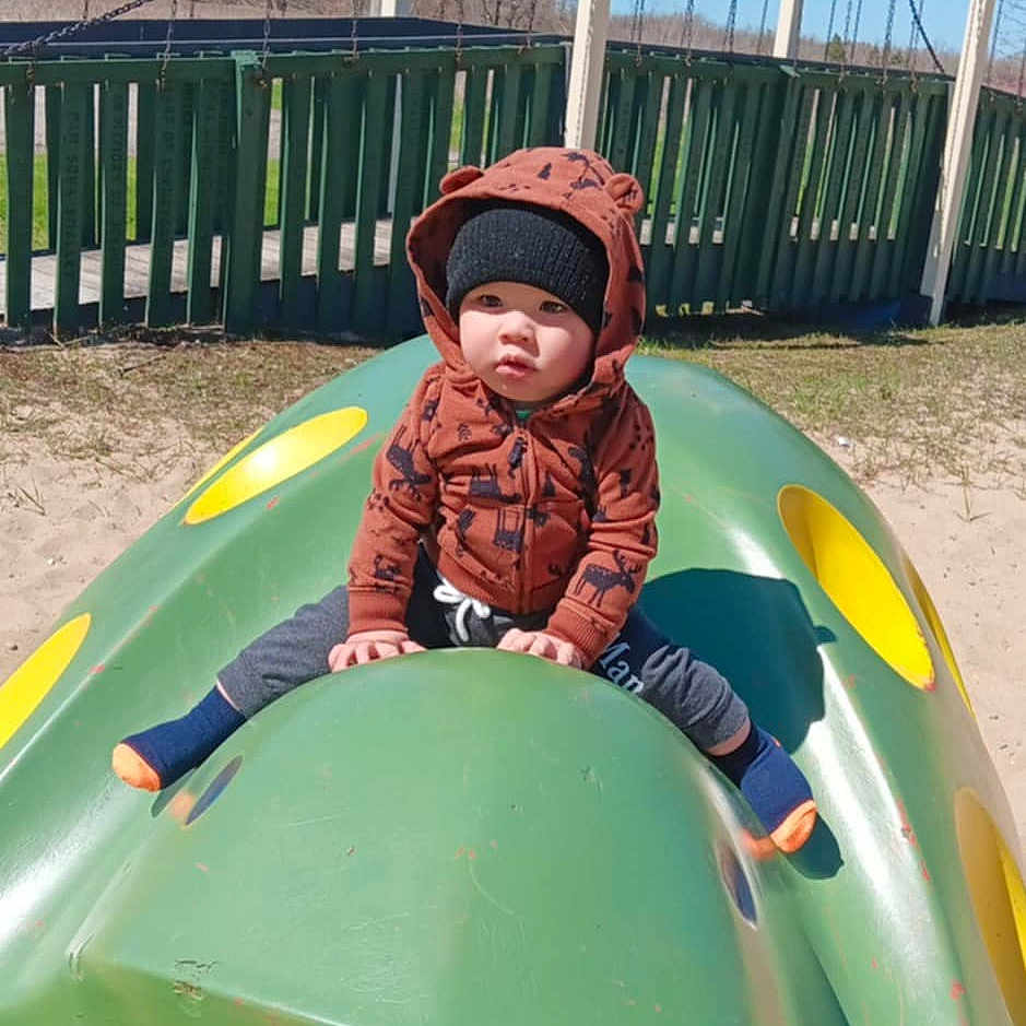 Dawson joined the competition — help win amazing prizes! baby, boy, child, clothing, coat, face, grass, head, jacket, male, nature, outdoorplayarea, outdoors, park, person, photography, plant, playarea, portrait, sliding