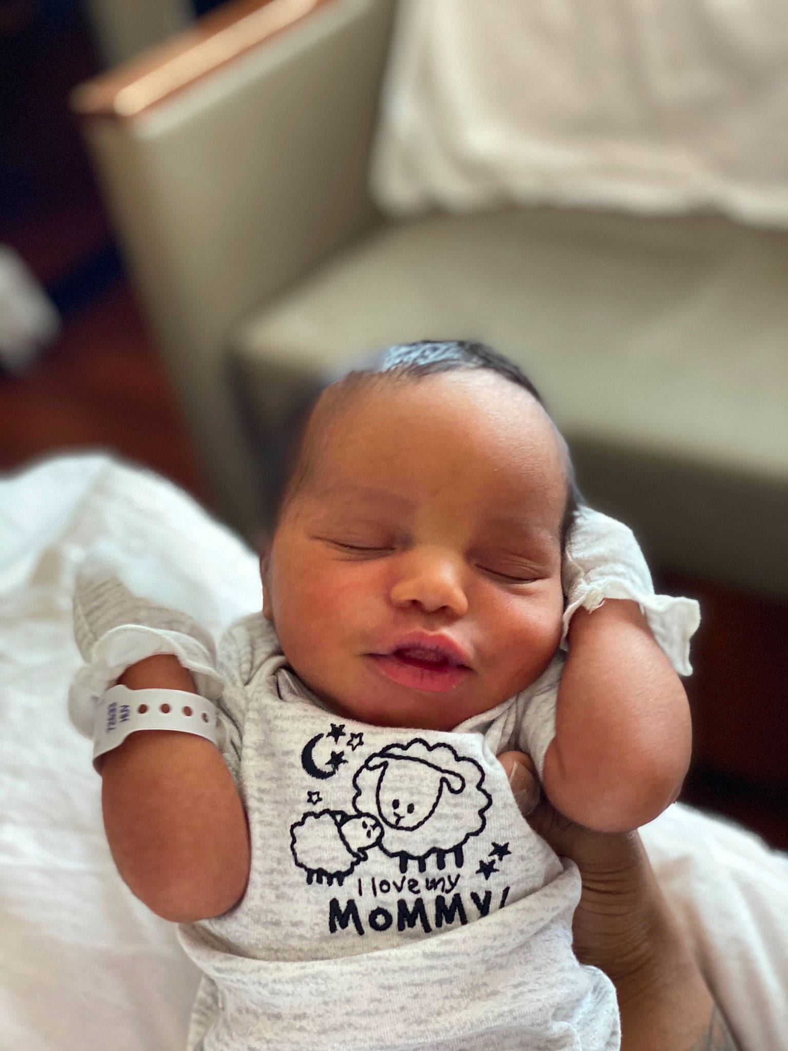 Hezekiah is registered to the contest to win money with this photo: baby, baby_toddler_clothing, cheek, comfort, dress, eye, eyebrow, eyelash, finger, happy, head, human_body, iris, lip, mouth, neck, nose, person, skin, sleeve