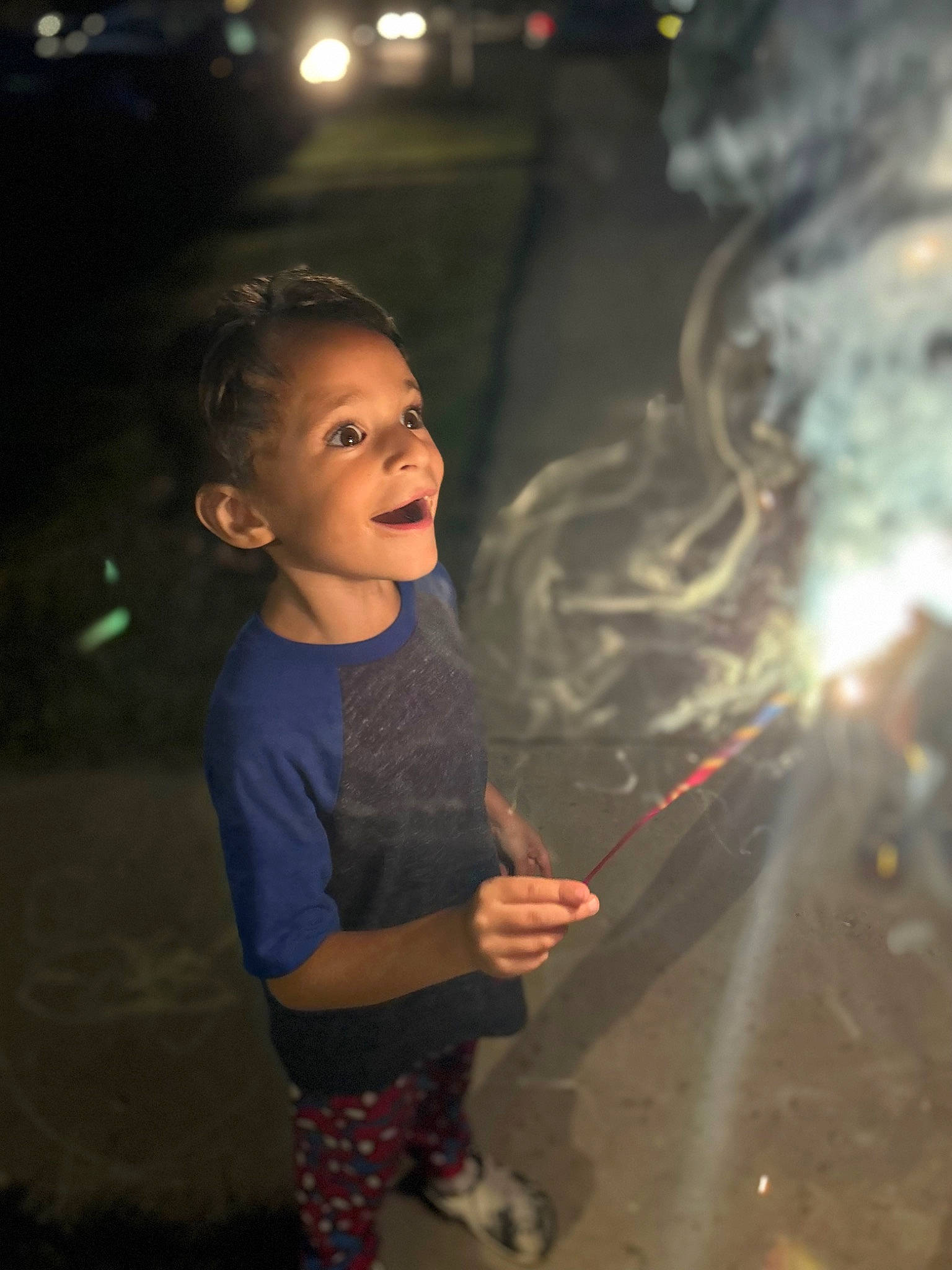 Emilio is registered to the contest to win money with this photo: artist, child, darkness, entertainment, event, flash_photography, fun, gesture, happy, leisure, lens_flare, midnight, night, performing_arts, person, sandal, shorts, smile, t_shirt, toddler