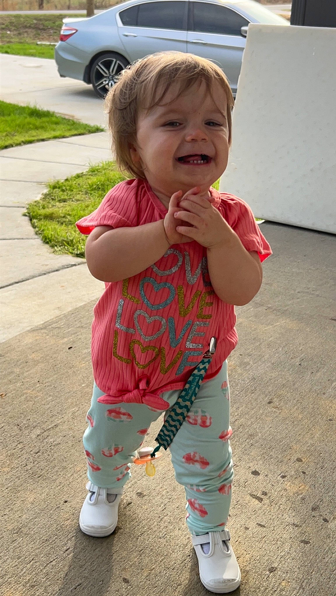 Mckinlee joined the competition — help win amazing prizes! baby, baby_toddler_clothing, child, face, fun, grass, happy, head, joy, pattern, person, photograph, pink, sitting, skin, sleeve, smile, sock, summer, t_shirt