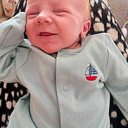 Frankie is registered to the contest to win money with this photo: baby, infant, smile, onesie, sailboat, clothing, blanket, pattern, face, head, cute, happy, resting, sleepy, soft, comfort, indoor, person, newborn, closeup