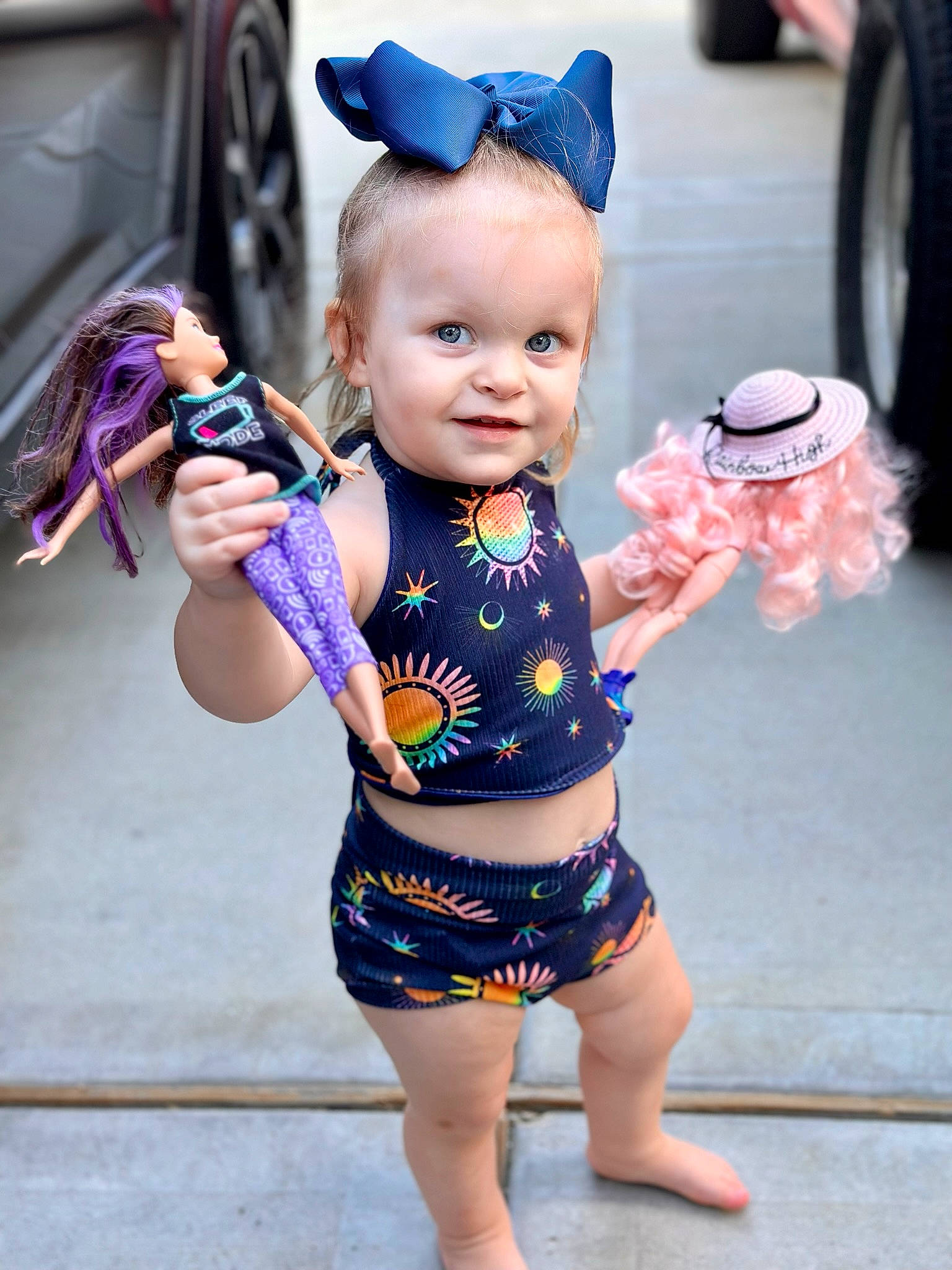 Sophie joined the competition — help win amazing prizes! baby, baby_toddler_clothing, blue, bottle, child, electric_blue, finger, fun, gesture, hand, happy, person, photograph, pink, skin, sleeve, smile, snapshot, tire, toddler