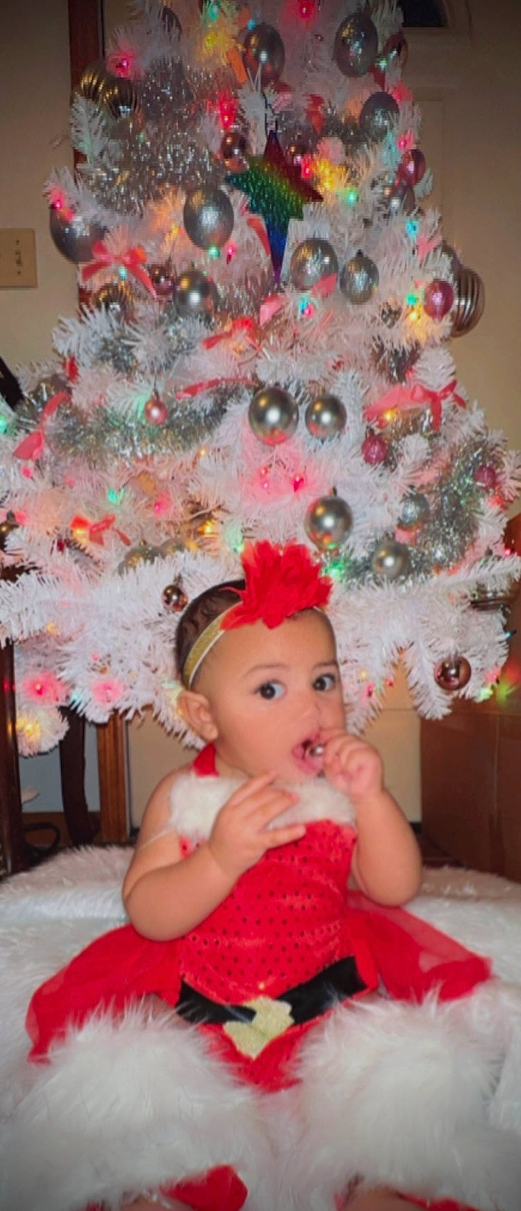 Arabella joined the competition — help win amazing prizes! christmas, christmas_decoration, christmas_eve, christmas_ornament, christmas_tree, costume_hat, decoration, event, evergreen, happy, headwear, holiday, holiday_ornament, ornament, party_supply, person, pink, plant, red, surprise