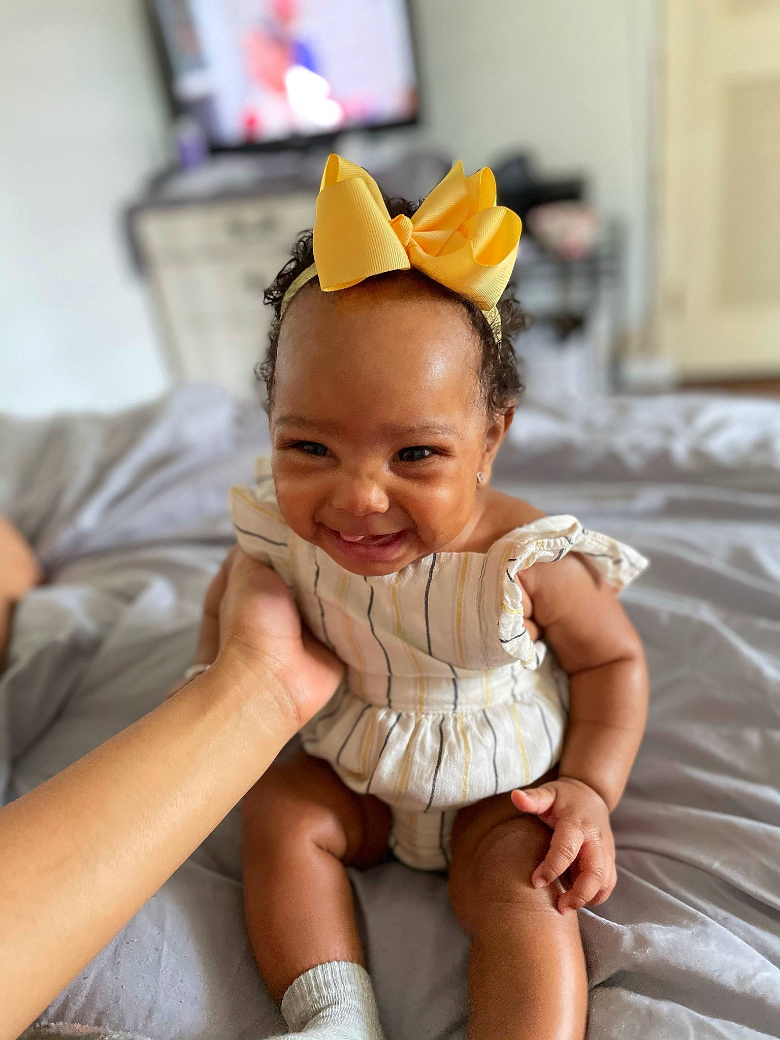 Aleena is registered to the contest to win money with this photo: blond, child, comfort, eye, fashion, fashion_accessory, flooring, fun, hair_accessory, hairstyle, happy, headband, headpiece, human_leg, jewellery, joy, person, sitting, smile, television