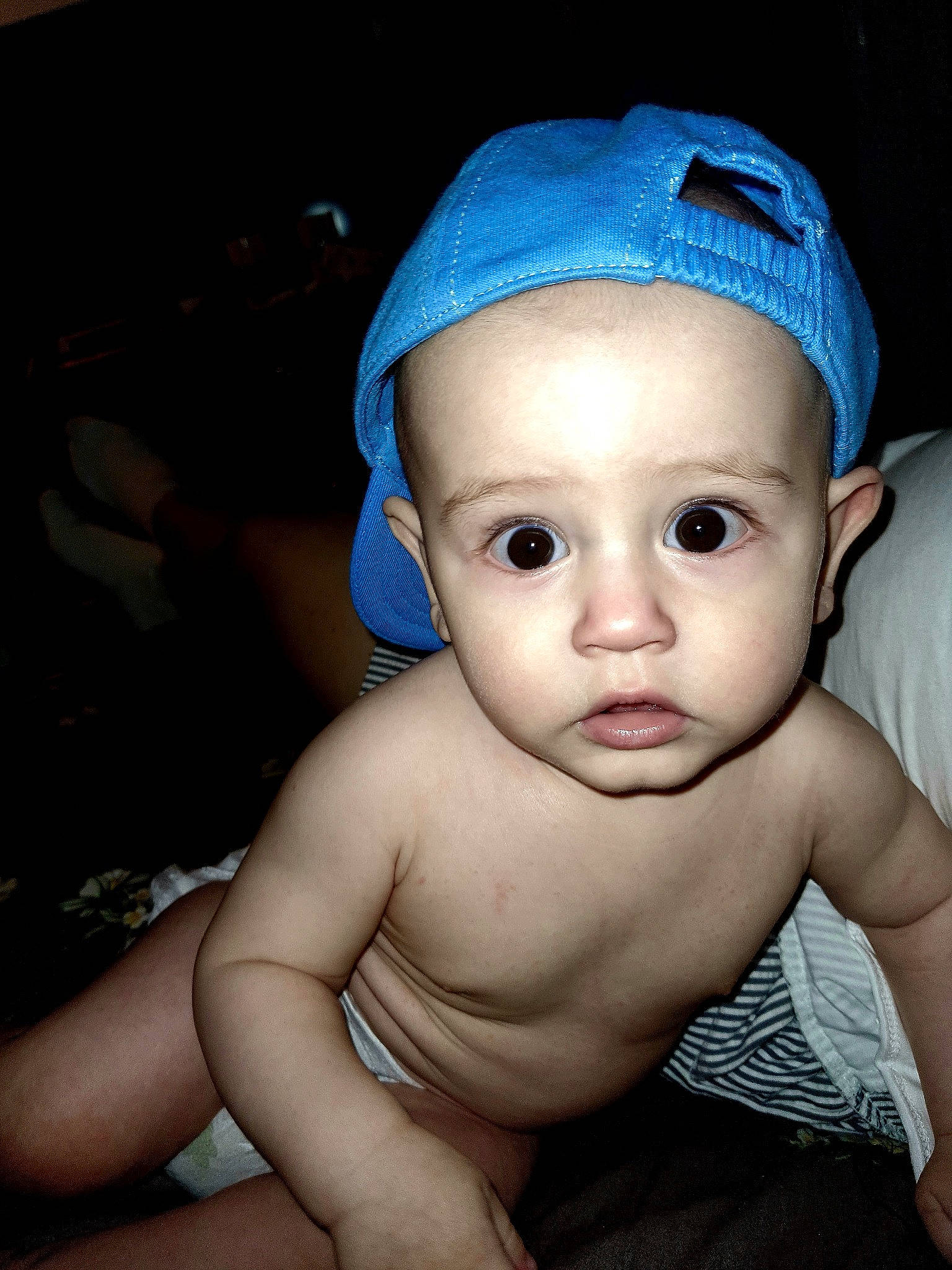 Cristian participe au concours pour gagner de l'argent avec cette photo : baby, black_hair, cap, cheek, chin, cool, eyebrow, eyelash, flash_photography, forehead, happy, headgear, iris, lip, mouth, neck, nose, person, skin, thumb