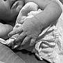 baby, infant, hand, skin, blanket, sleeping, closeup, black_and_white, soft, fabric, newborn, cute, peaceful, rest, human, child, wrapped, fingers, portrait, tender
