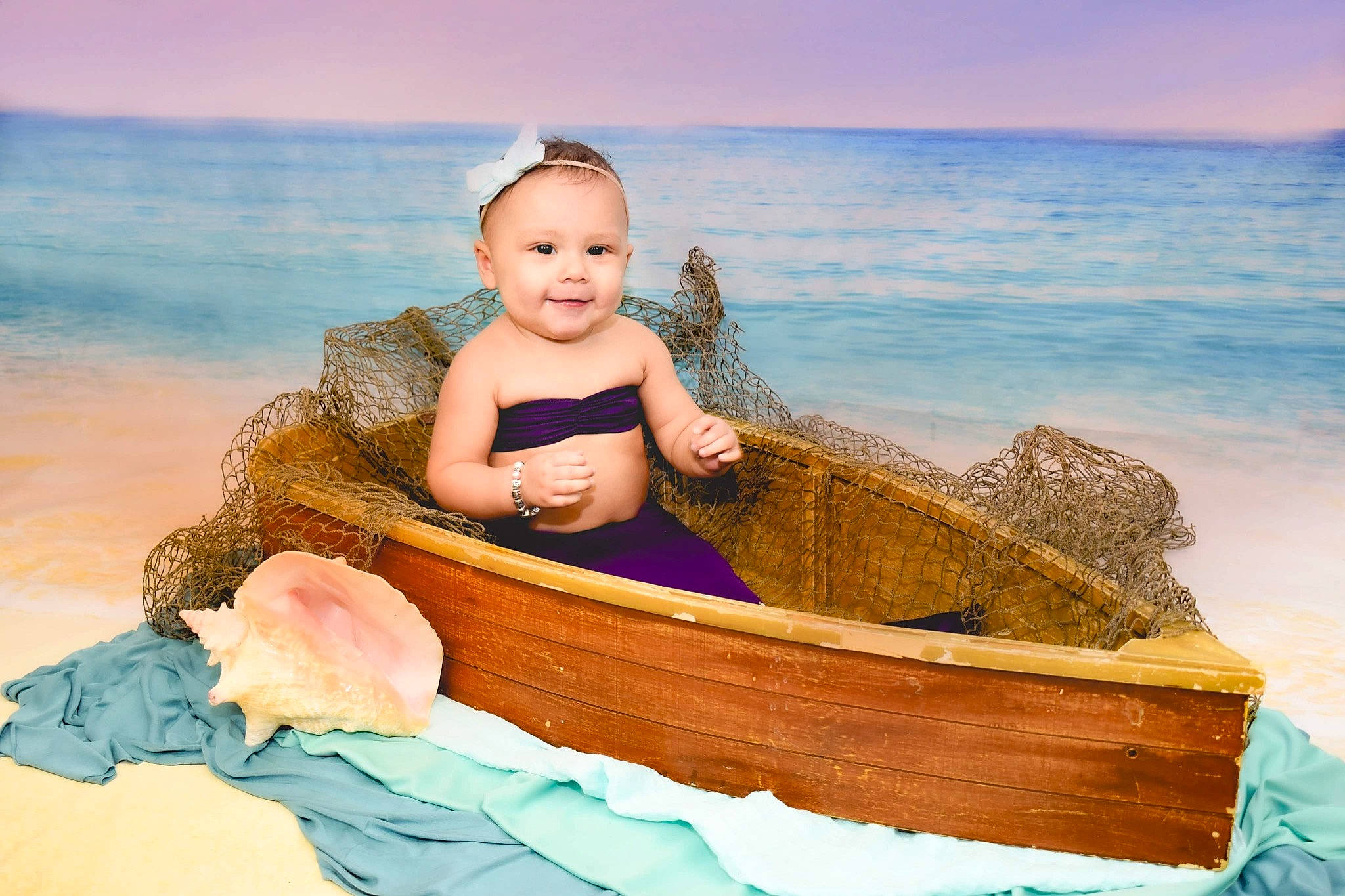 Jilliana is registered to the contest to win money with this photo: azure, beach, body_of_water, comfort, facial_expression, flash_photography, hair, hairstyle, happy, human, joy, leisure, people_in_nature, people_on_beach, person, skin, sky, smile, toddler, travel