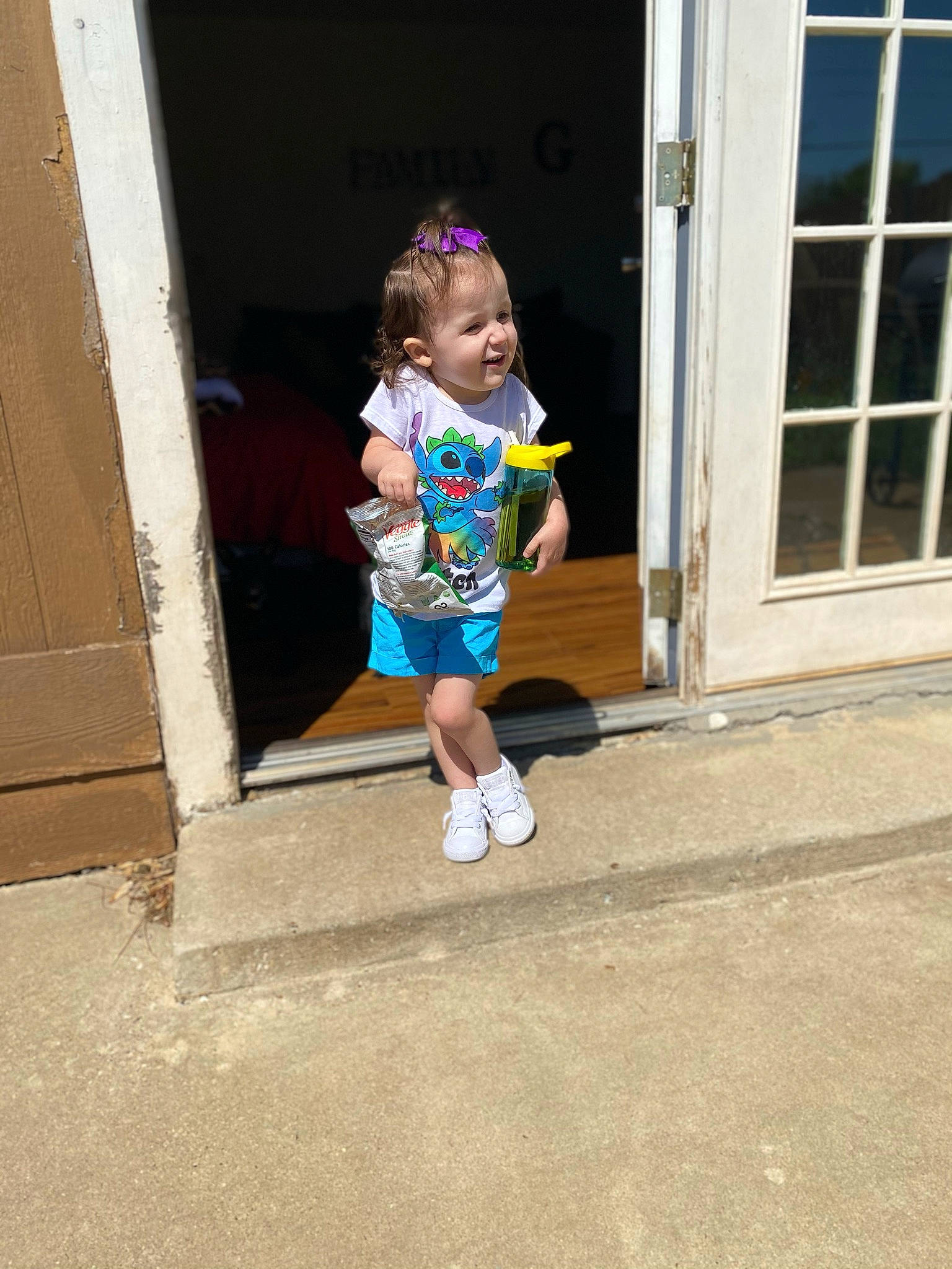 Maisie joined the competition — help win amazing prizes! asphalt, baby, baby_toddler_clothing, child, city, door, electric_blue, happy, human_leg, leg, leisure, person, recreation, road, shorts, sleeve, street_fashion, t_shirt, thigh, toddler