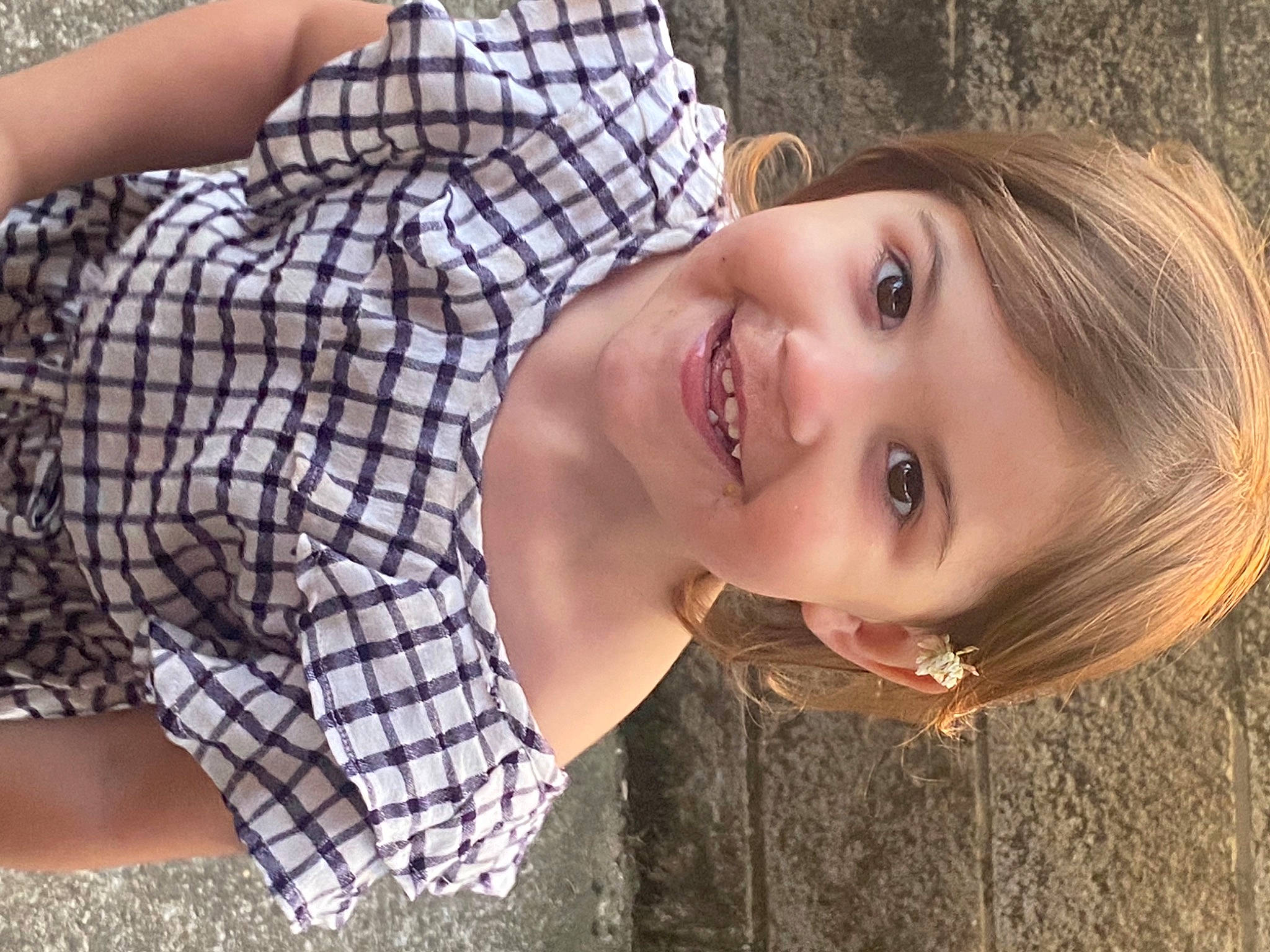 Melodi is registered to the contest to win money with this photo: black_hair, child, cool, eyelash, flash_photography, fun, grass, happy, hat, joy, lip, long_hair, mouth, person, plaid, plant, skin, smile, street_fashion, tartan