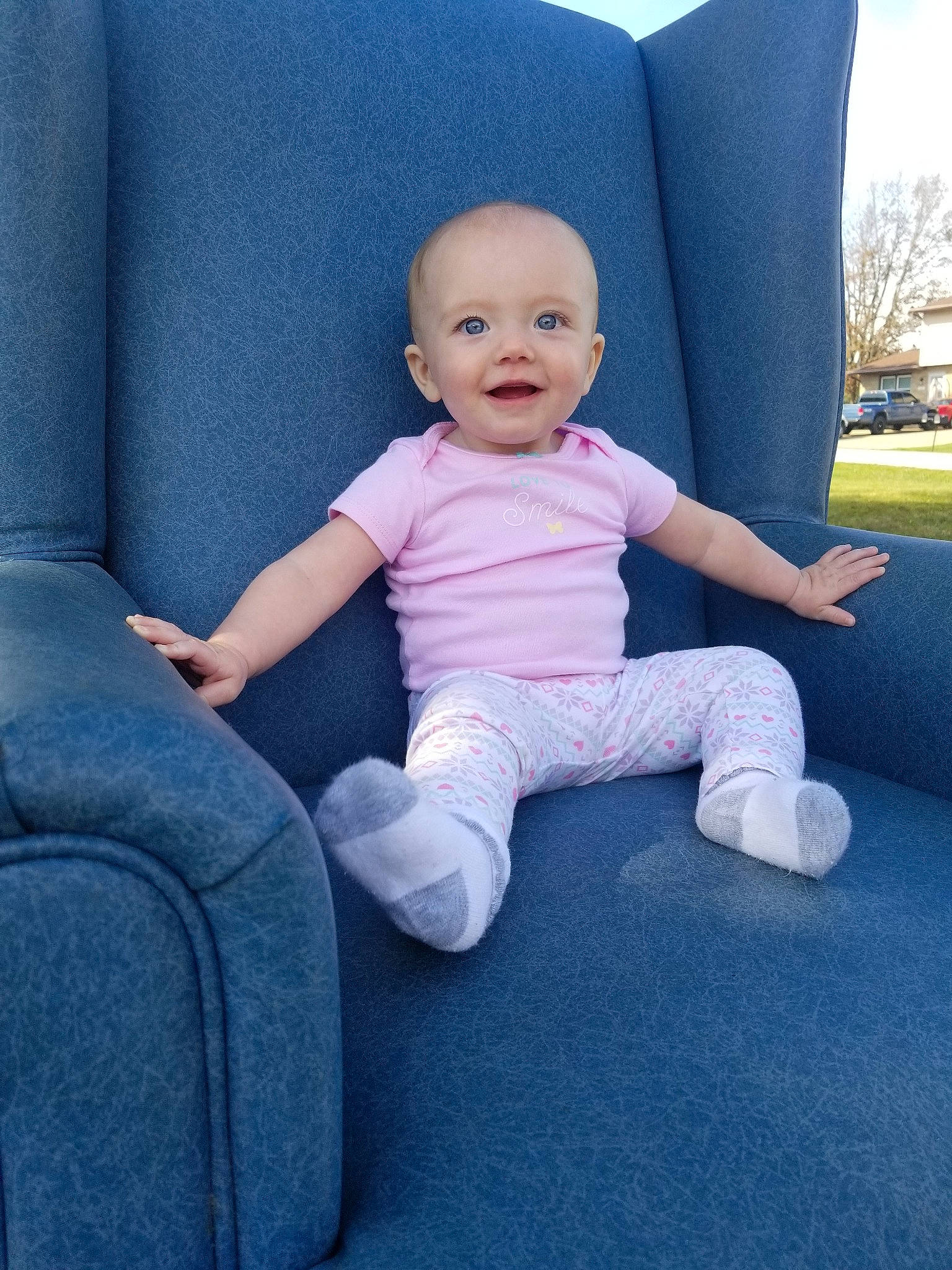 Adilynn joined the competition — help win amazing prizes! baby, blue, car_seat, child, furniture, leg, person, pink, sitting, skin, smile, toddler