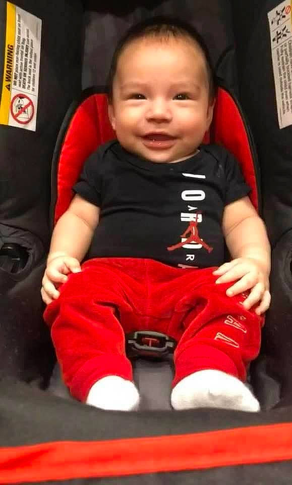 Cory is registered to the contest to win money with this photo: baby, baby_toddler_clothing, cheek, child, chin, comfort, face, finger, flooring, fun, happy, head, joy, knee, person, photograph, sitting, skin, sleeve, smile