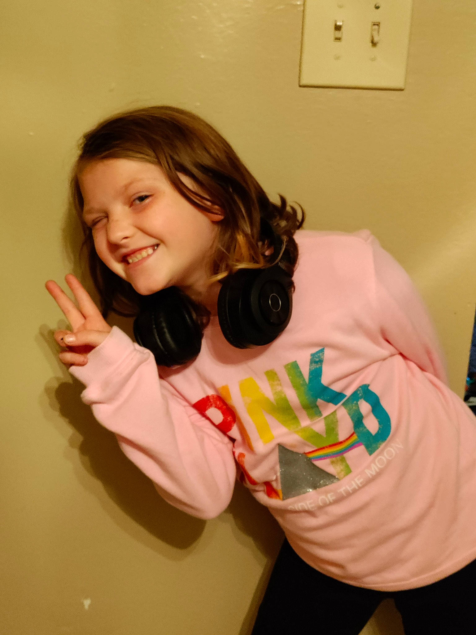 Abbiegail is registered to the contest to win money with this photo: arm, brown_hair, child, elbow, eyelash, finger, fun, gesture, happy, joy, light_switch, long_hair, mouth, neck, person, room, shoulder, sleeve, smile, t_shirt