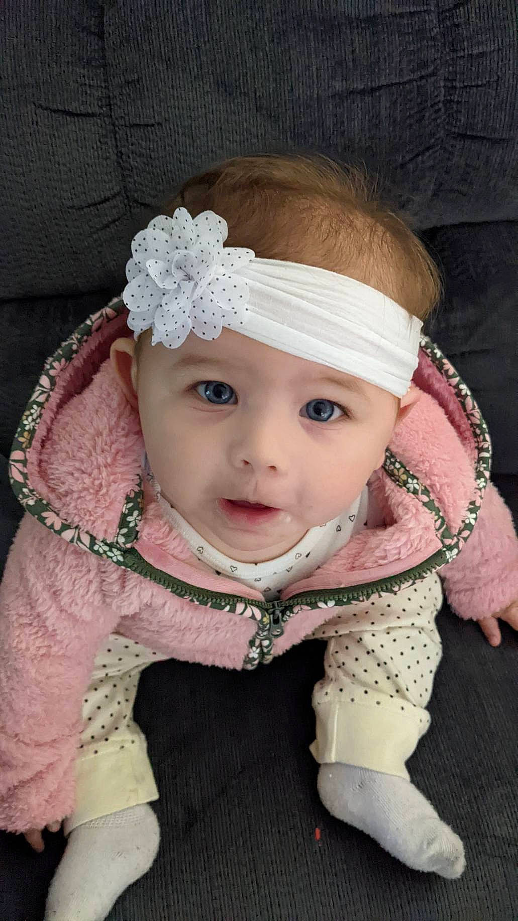 Lilah joined the competition — help win amazing prizes! baby, baby_toddler_clothing, cap, cheek, child, collar, costume_hat, embellishment, eye, eyebrow, eyelash, head, headband, headpiece, headwear, iris, jewellery, person, pink, sleeve