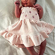 Aurora is registered to the contest to win money with this photo: baby, blanket, child, clothing, cute, feet, hand, human, indoors, infant, lying_down, newborn, peaceful, pink_dress, portrait, resting, skin, sleeping, soft, strawberry