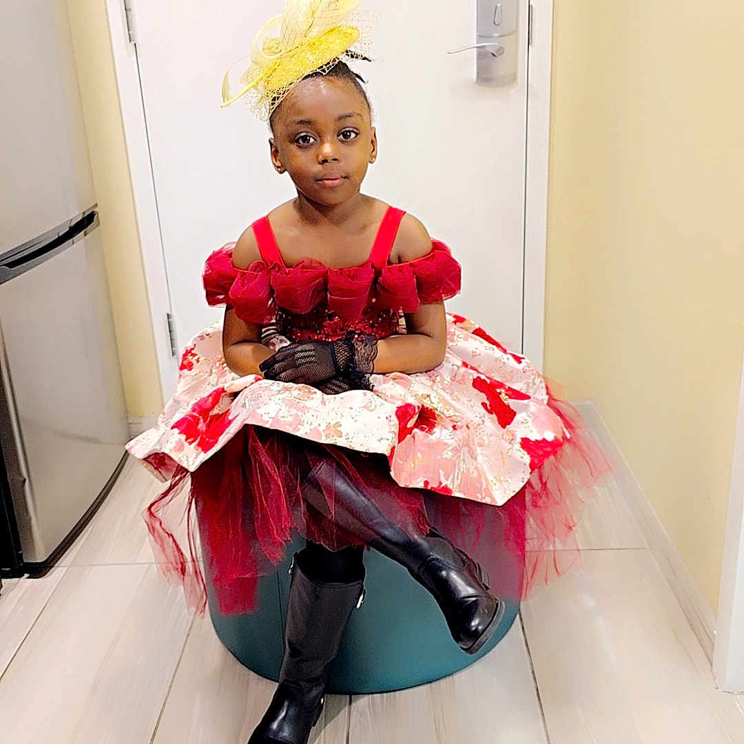 Ella-Maya joined the competition — help win amazing prizes! appliance, child, clothing, costume, device, dress, face, female, footwear, girl, hardwood, head, highheel, indoors, person, photography, portrait, shoe, sitting, wood