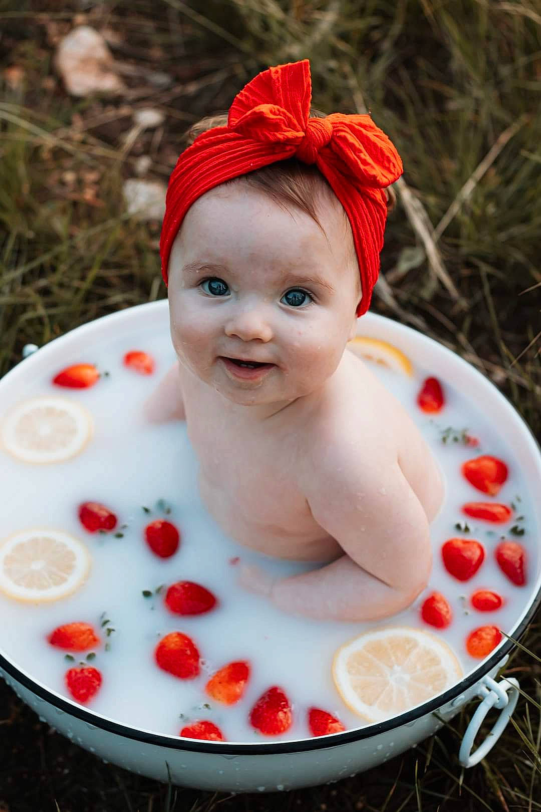 Joelle is registered to the contest to win money with this photo: baby, baby_products, baby_toddler_clothing, cap, child, dress, face, fashion_accessory, grass, happy, hat, jewellery, joy, leisure, lip, person, plant, recreation, red, smile