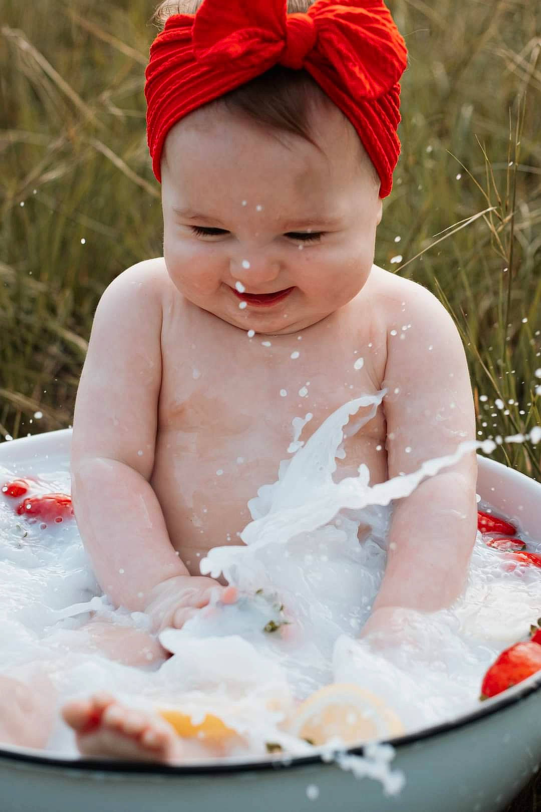 Joelle joined the competition — help win amazing prizes! baby, baby_bathing, bathing, beauty, cap, child, dress, face, facial_expression, fun, grass, happy, human_body, leisure, people, person, pink, skin, smile, toddler