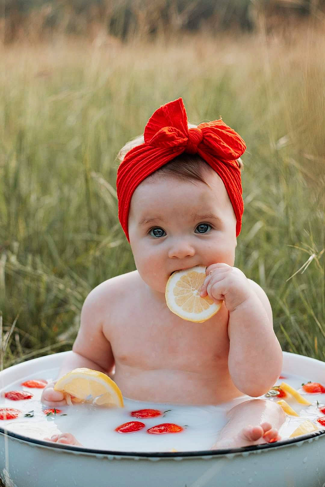 Joelle joined the competition — help win amazing prizes! baby, baby_toddler_clothing, cap, child, face, food, food_craving, fun, grass, happy, hat, leisure, people_in_nature, person, photograph, play, recreation, sitting, skin, sweetness