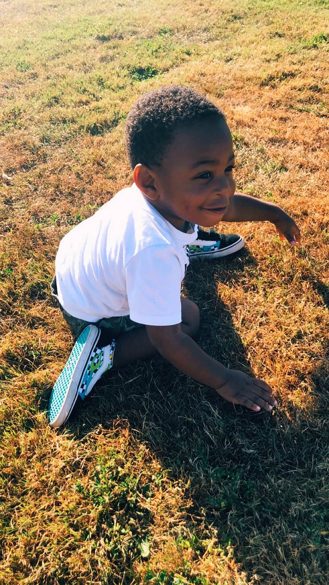 Alfa is registered to the contest to win money with this photo: adaptation, child, grass, happy, person, plant, soil