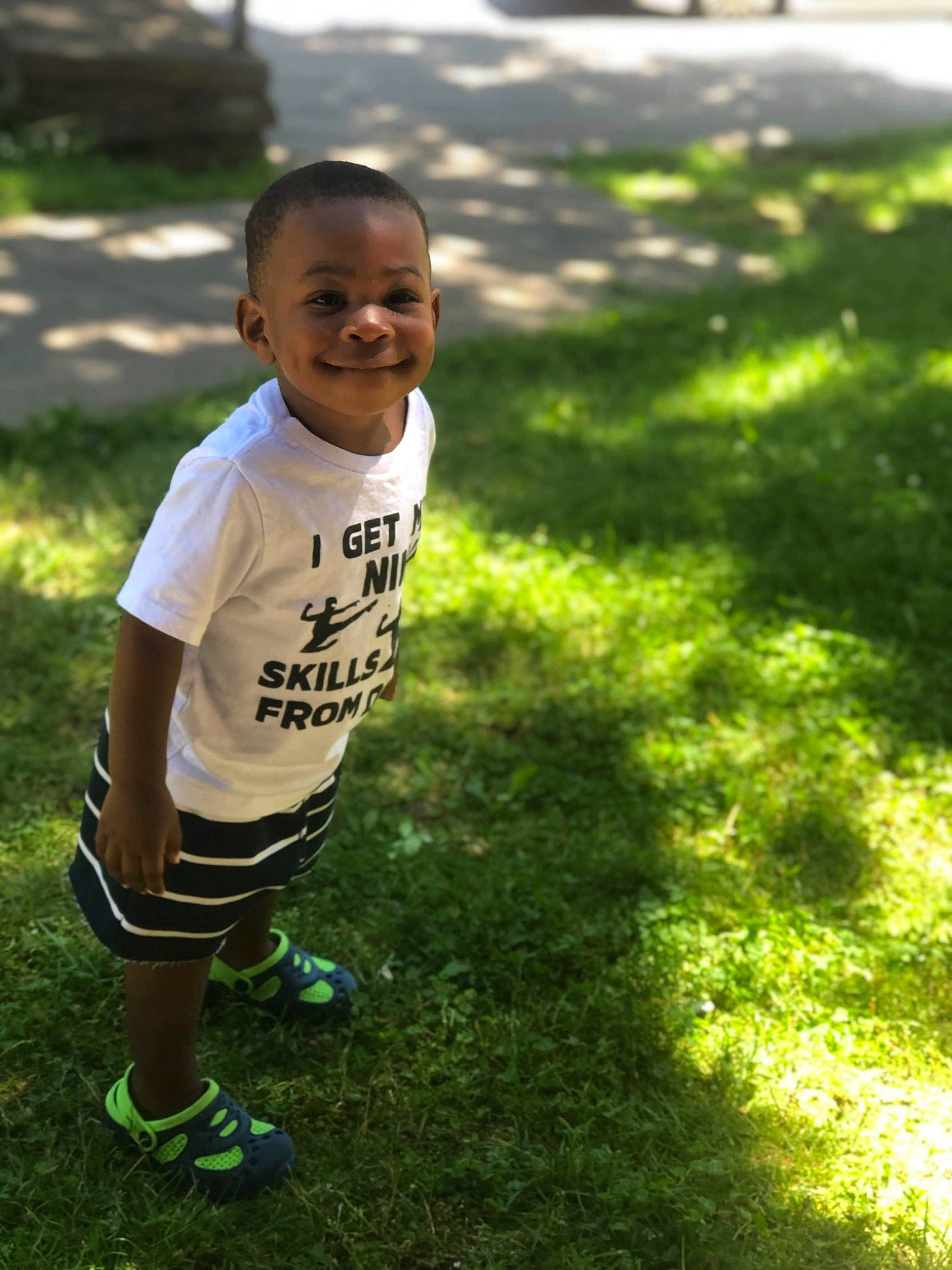 Alfa is registered to the contest to win money with this photo: child, grass, green, happy, joy, lawn, leaf, leisure, person, plant, play, smile, summer, sunlight, t_shirt, toddler, tree
