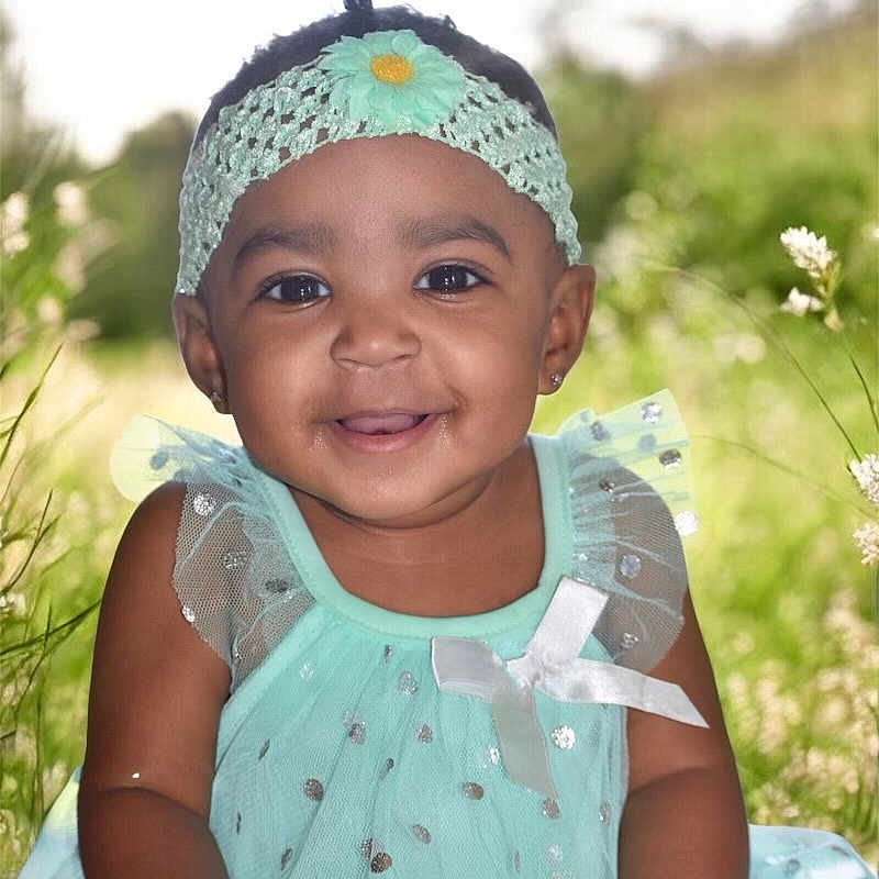 Saroya joined the competition — help win amazing prizes! baby, child, closeup, cute, dress, flower, girl, grass, happy, headband, mint_green, nature, outdoor, person, portrait, sitting, smiling, sparkles, sunlight, young_child