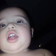 Lorenzo is registered to the contest to win money with this photo: baby, child, infant, face, portrait, selfie, close_up, night, flash, dark_background, blue_eyes, open_mouth, drool, expression, bare_shoulders, skin, head, indoor, photography, person
