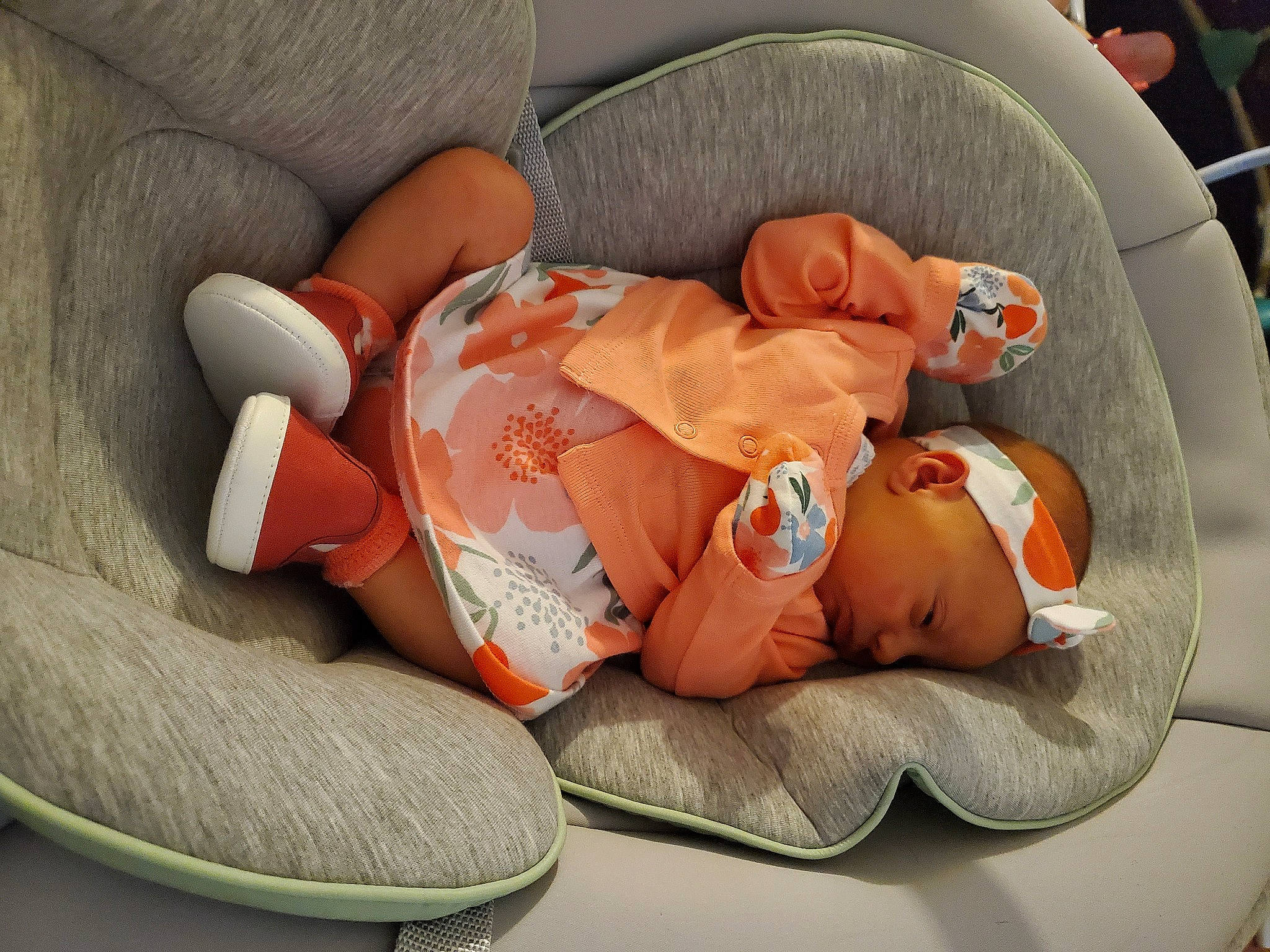 Ruby Rose is registered to the contest to win money with this photo: baby, baby_products, baby_toddler_clothing, carmine, child, comfort, foot, hat, health_care, human_leg, linens, orange, person, room, sitting, sleep, toddler