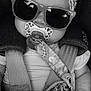 Maddy participe au concours pour gagner de l'argent avec cette photo : baby, pacifier, sunglasses, headband, car_seat, straps, infant, black_and_white, close_up, cute, child, fashion, accessory, portrait, seatbelt, patterned_cloth, adorable, young_child, baby_toy, infant_clothing
