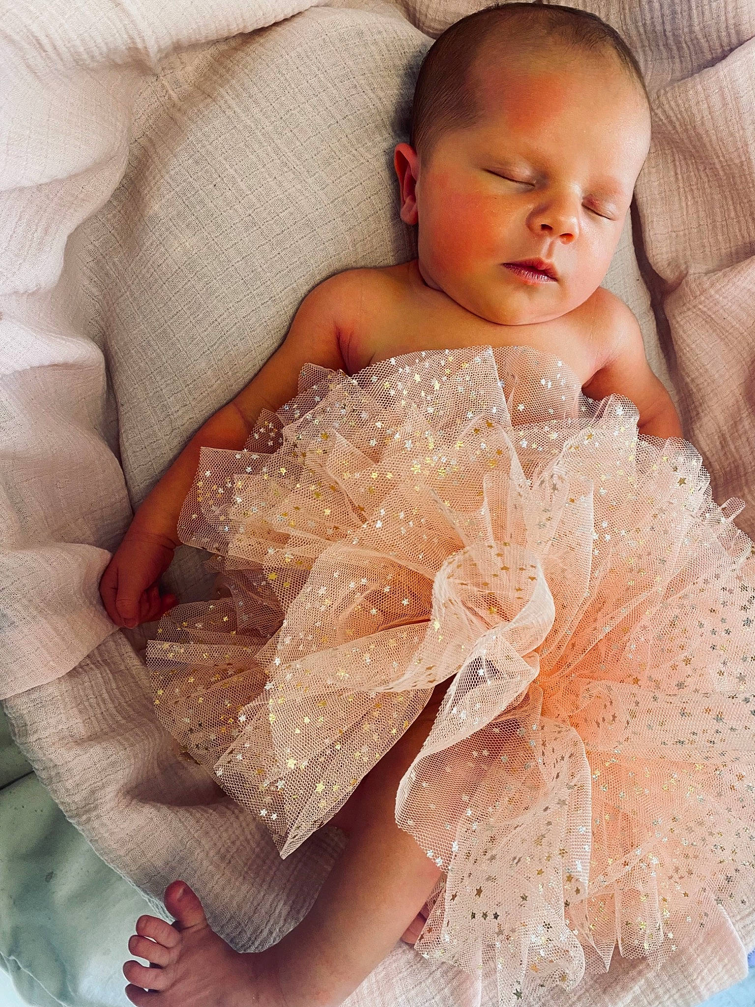 Abigail is registered to the contest to win money with this photo: arm, baby, baby_toddler_clothing, bridal_accessory, chest, child, comfort, day_dress, dress, embellishment, event, hairstyle, happy, headpiece, linens, neck, person, shoulder, skin, textile