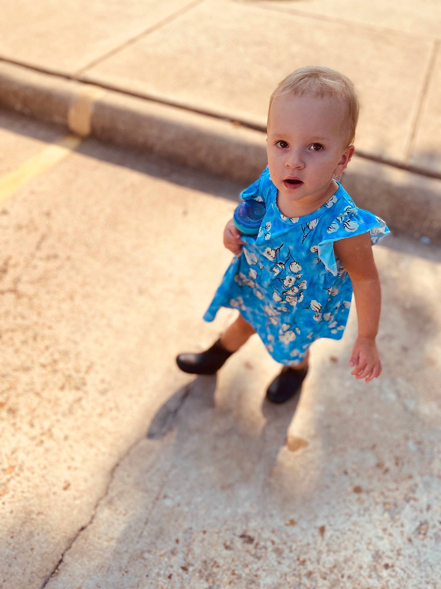 Adeline is registered to the contest to win money with this photo: baby, baby_toddler_clothing, electric_blue, floor, flooring, fun, grass, happy, iris, leisure, people_in_nature, person, recreation, sitting, skin, sleeve, smile, soil, t_shirt, toddler