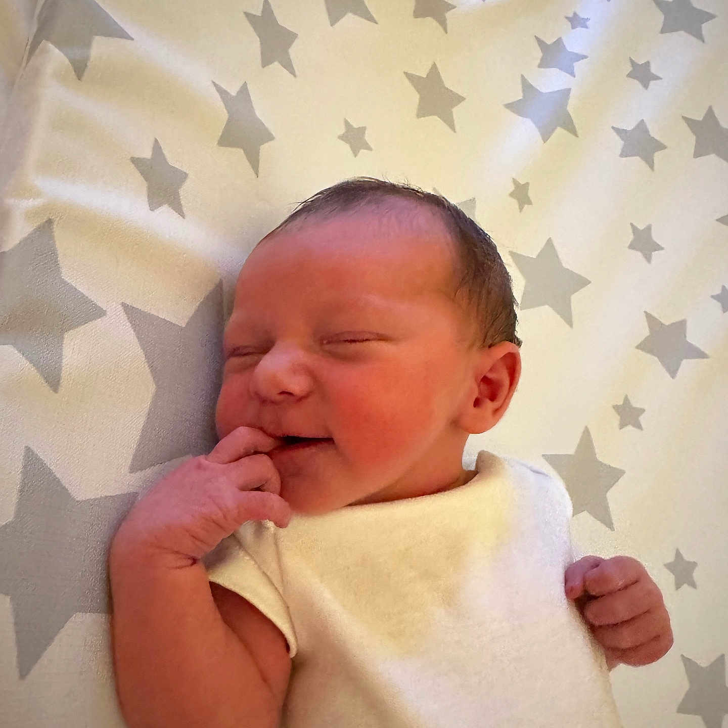 Sandy-Ann is registered to the contest to win money with this photo: adorable, baby, blanket, child, cute, face, hand, indoors, infant, lying_down, newborn, pattern, peaceful, portrait, skin, sleeping, small, soft, stars, white_clothing