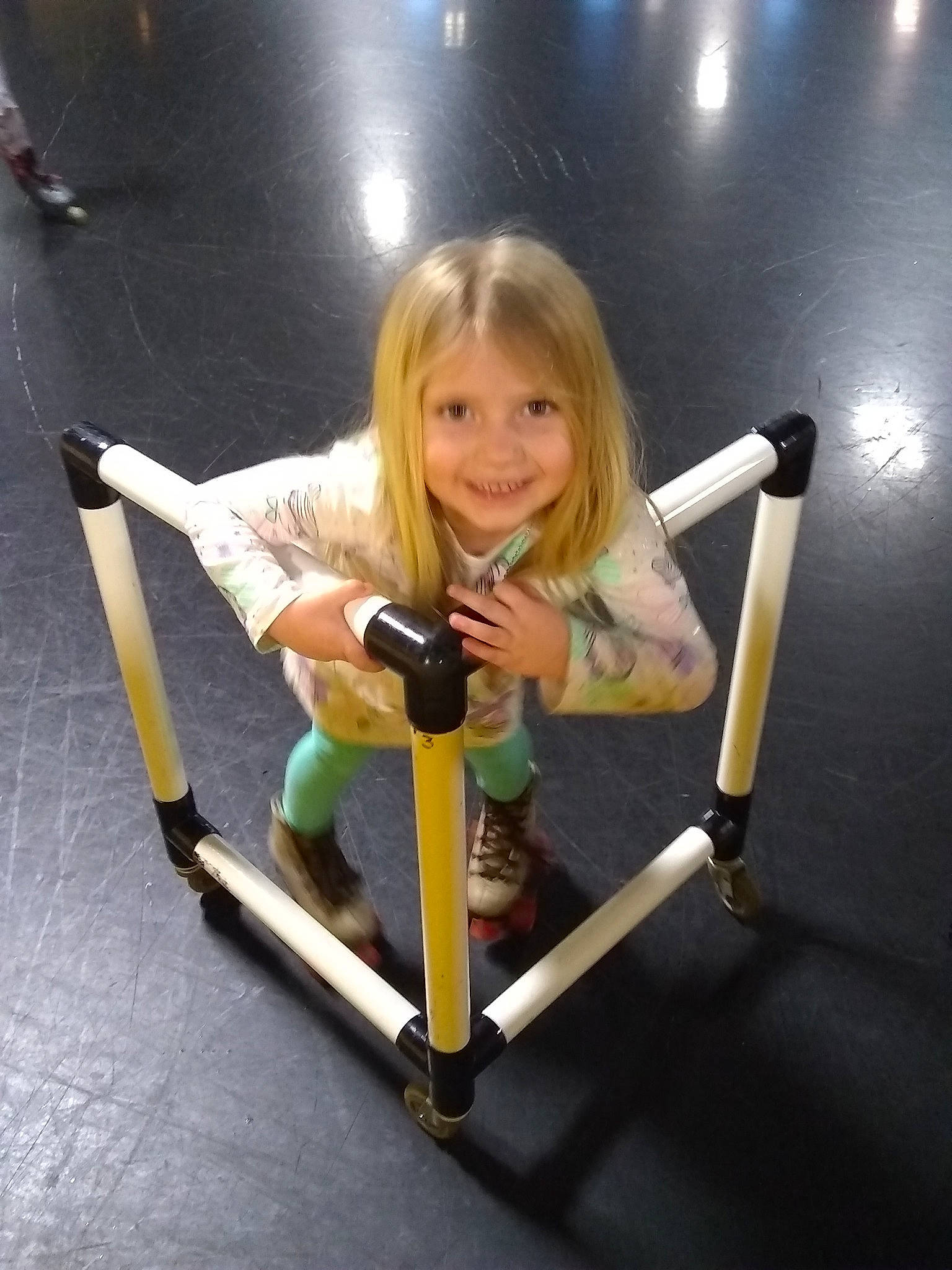 Lillah is registered to the contest to win money with this photo: arm, child, exercise_machine, fun, girl, indoor_games_and_sports, joint, joy, leg, person, physical_fitness, product, sport_venue, structure