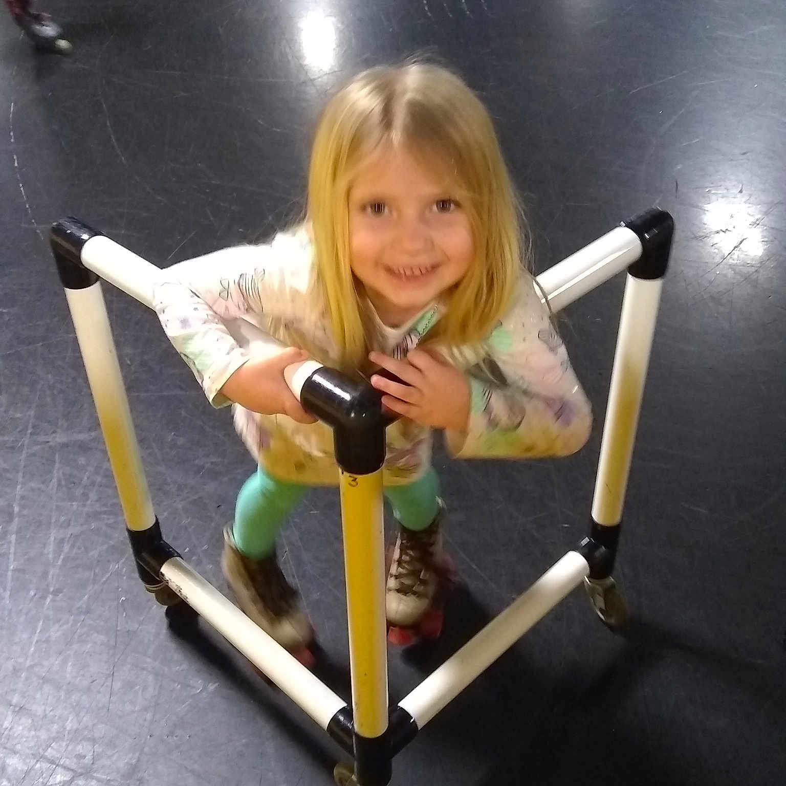 Lillah is registered to the contest to win money with this photo: arm, child, exercise_machine, fun, girl, indoor_games_and_sports, joint, joy, leg, person, physical_fitness, product, sport_venue, structure