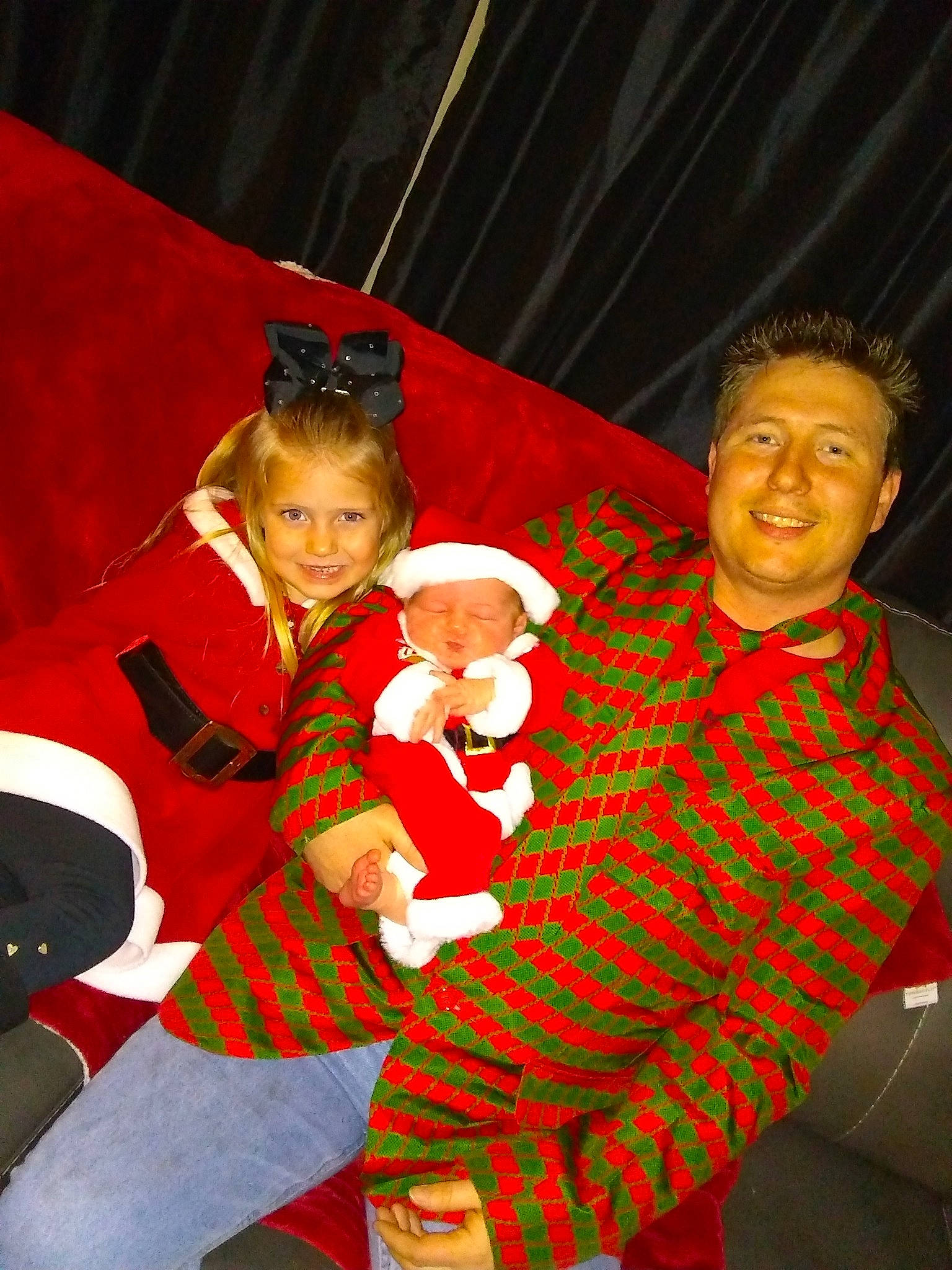 Lillah is registered to the contest to win money with this photo: child, christmas, christmas_decoration, costume, event, fun, girl, holiday, joy, lap, performance, performing_arts, person, product, red, santa_claus, smile, toddler, tradition