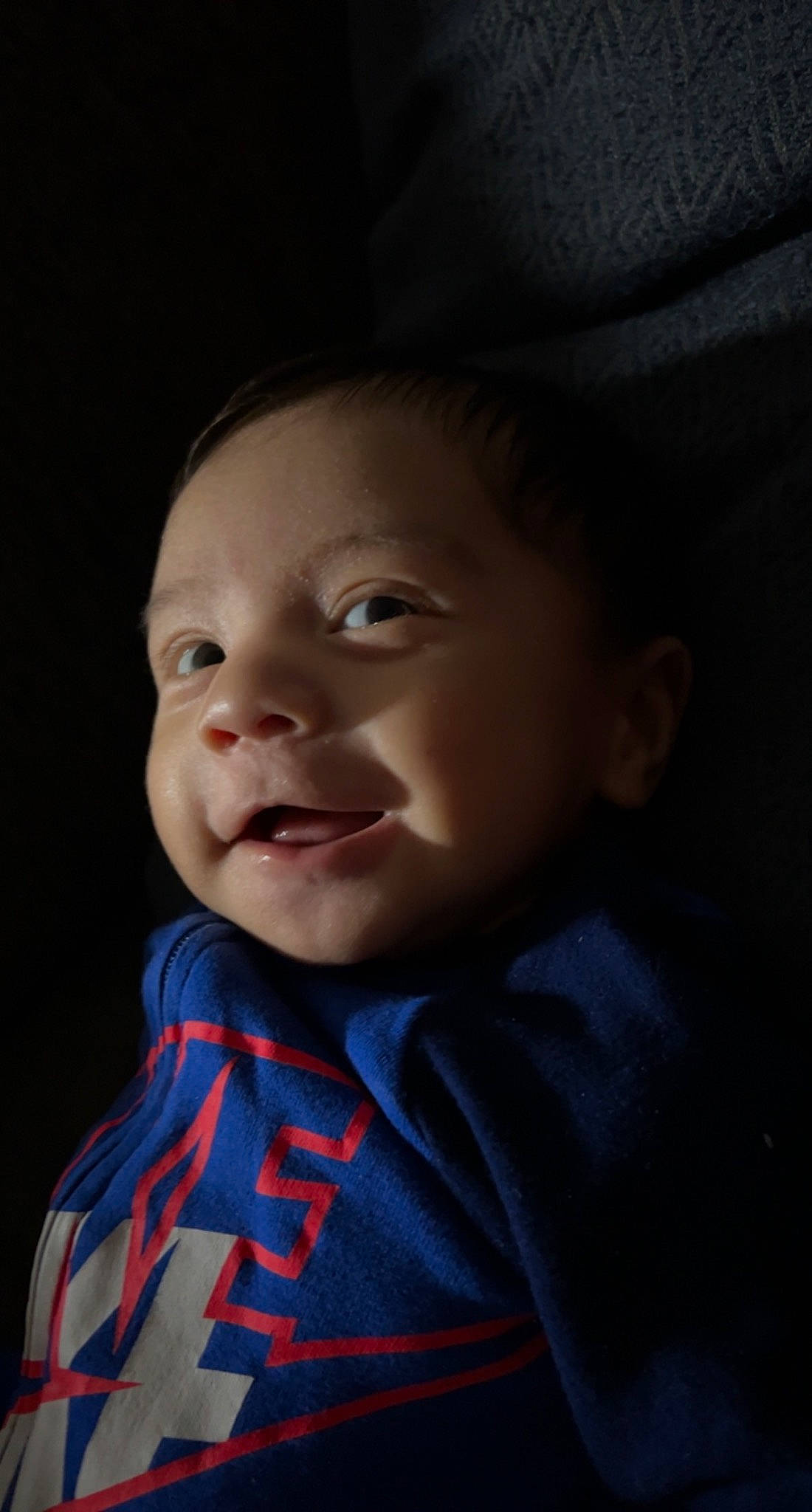 Armani is registered to the contest to win money with this photo: baby, cheek, chin, electric_blue, eye, eyebrow, flash_photography, forehead, happy, iris, lip, mouth, nose, outerwear, person, plant, skin, sleeve, smile, toddler