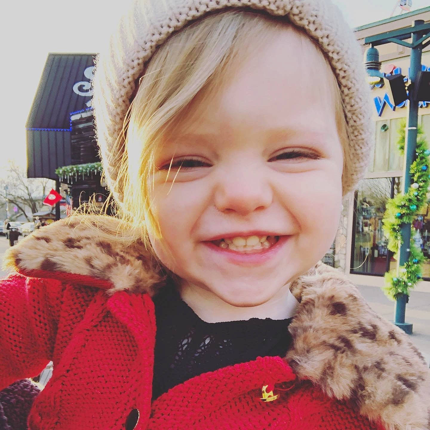 Logan is registered to the contest to win money with this photo: blond, cheek, child, ear, eye, face, facial_expression, fur, hair, happy, head, headgear, joy, lip, nose, organ, outerwear, people, person, skin