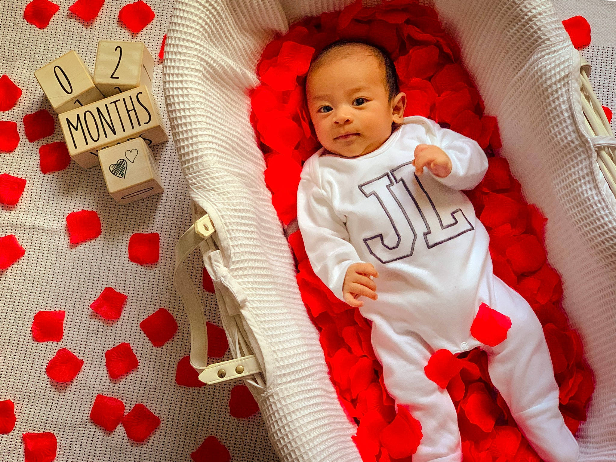 James Leon is registered to the contest to win money with this photo: baby, baby_products, baby_safety, baby_sleeping, baby_toddler_clothing, carmine, child, comfort, event, font, happy, linens, pattern, person, red, room, sleeve, t_shirt, textile, throw_pillow