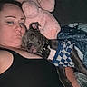 Lucky joined the competition — help win amazing prizes! person, dog, cuddling, blanket, pillow, indoor, sleepy, pet, casual_clothing, resting, companion, cozy, checkered_shirt, furniture, closeup, living_room, relaxing, home, animal, portrait
